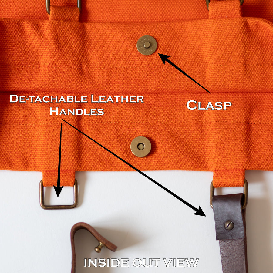 Inside out view of Oversized orange cotton canvas bag with daffodils and leather handles
