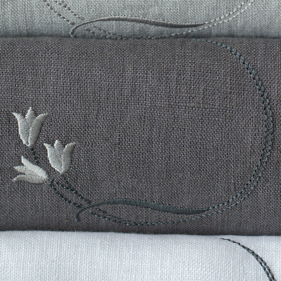 Tulip embroidery on dark grey linen napkin