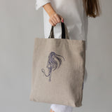 Linen handbag with leather handles and contemporary embroidery design