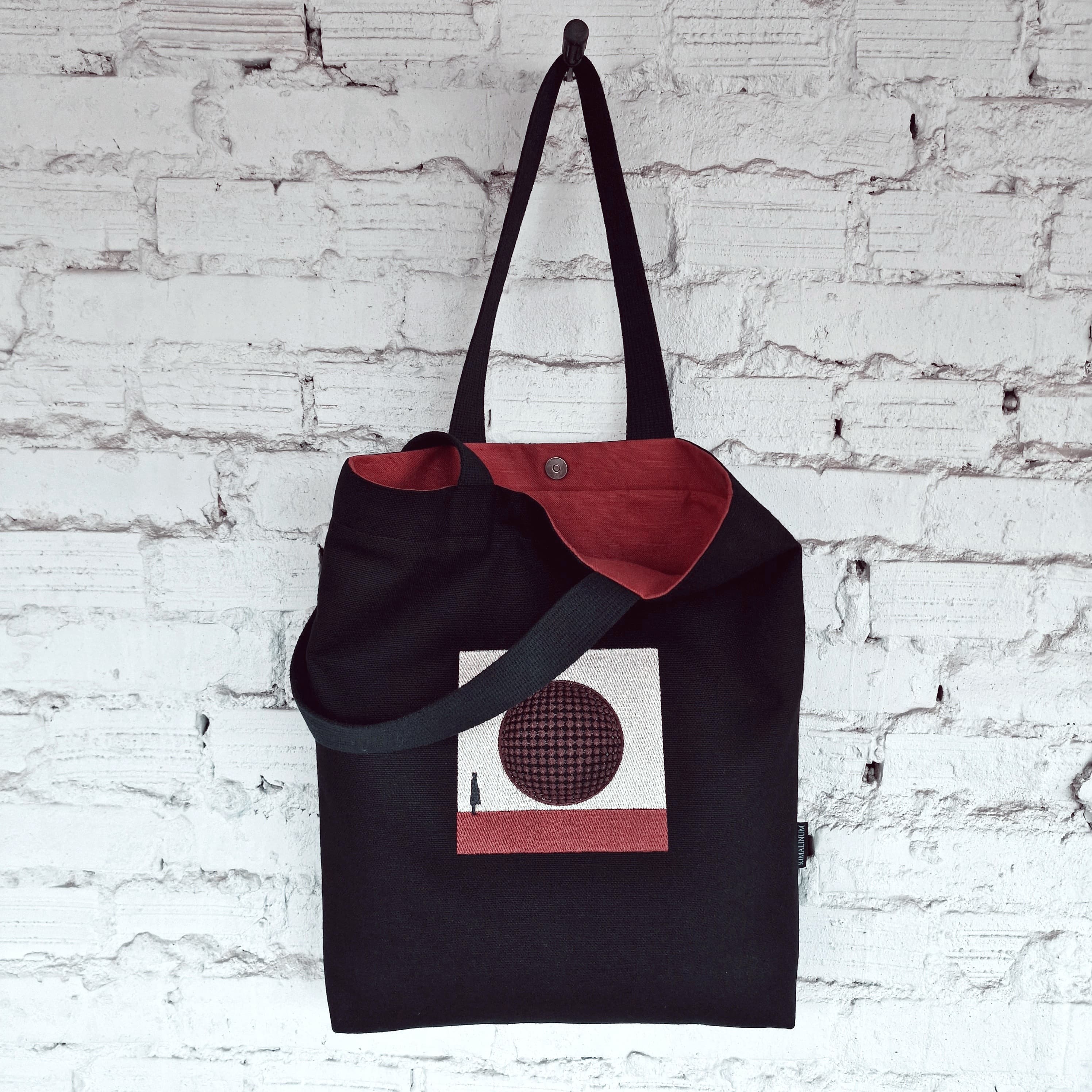 Black Tote Bag Embroidery of a burgundy circle