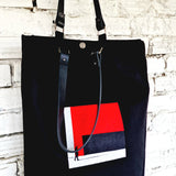 Linen bag with leather handle and moder geometric embroidery in red, white and black