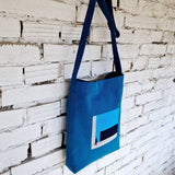 Stylish blue linen and cotton canvas crossbody bag with abstract urban design