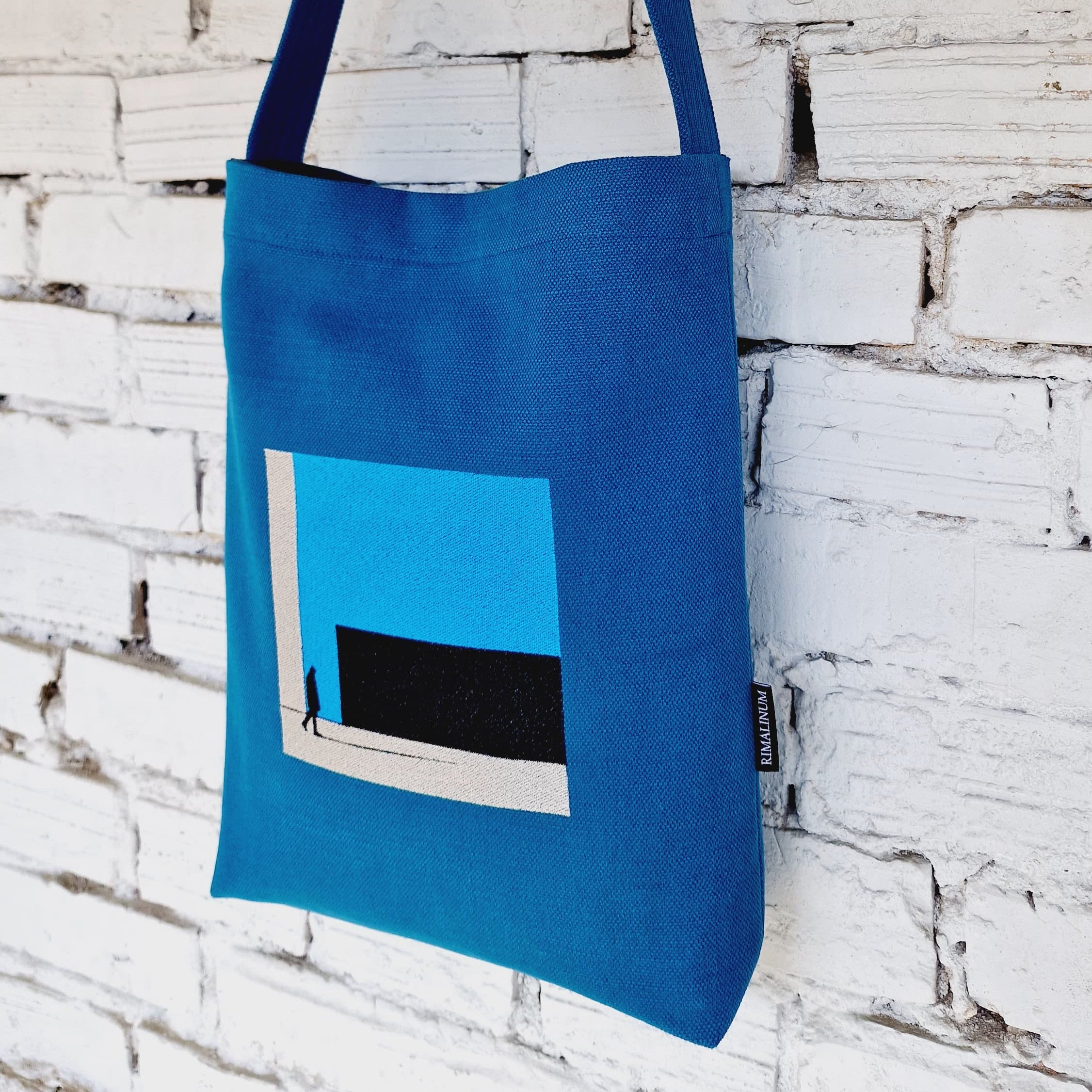 Minimalist handmade blue linen and cotton canvas bag with Rimalinum logo