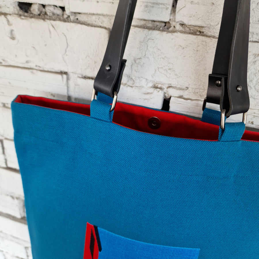 Blue cotton canvas bag with embroidery and removable leather handles