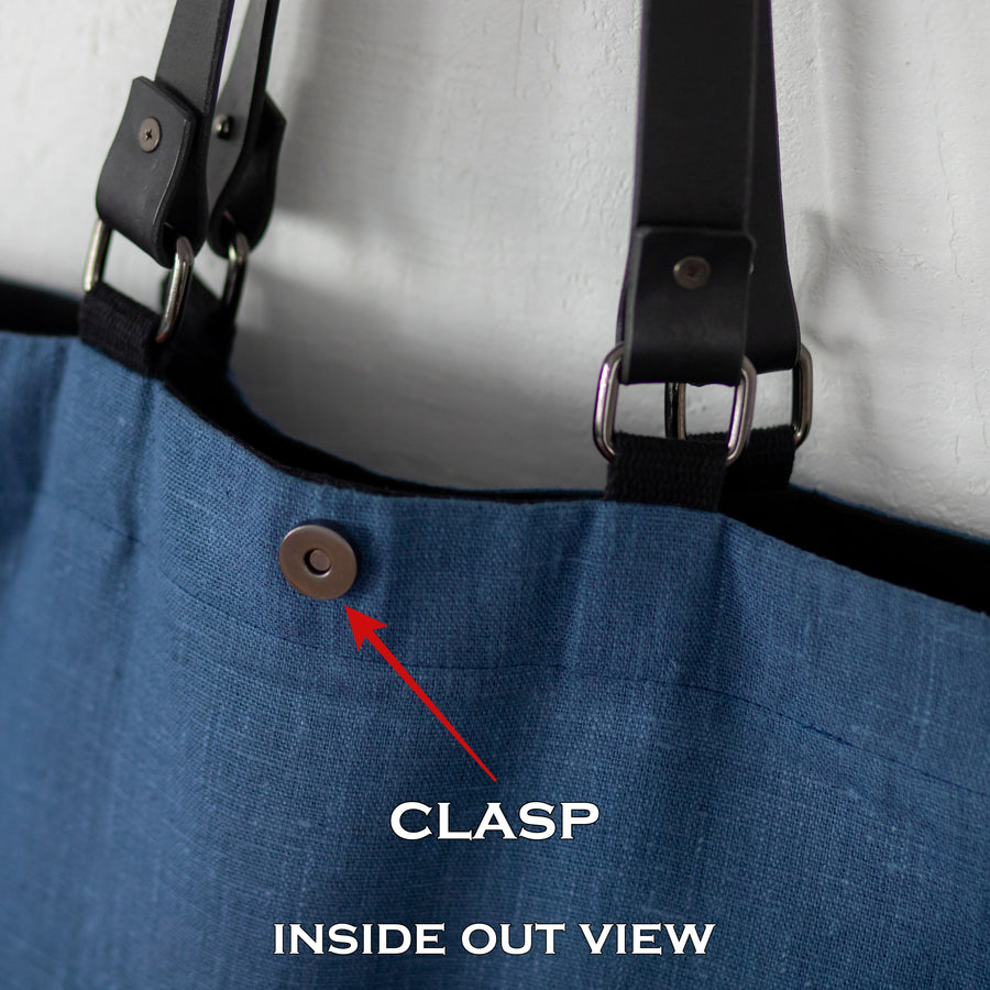 Inside out view of Oversized black canvas shoulder bag with embroidery and leather handles