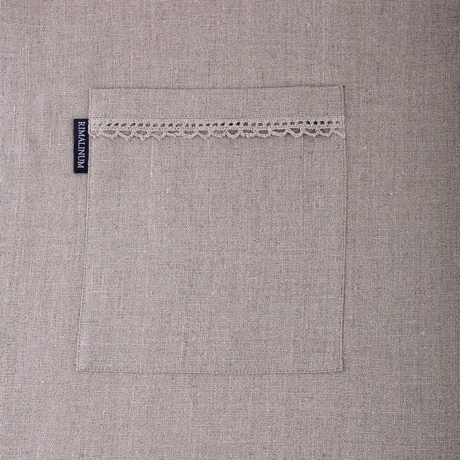 Hazel laces on linen apron pocket with Rimalinum sign