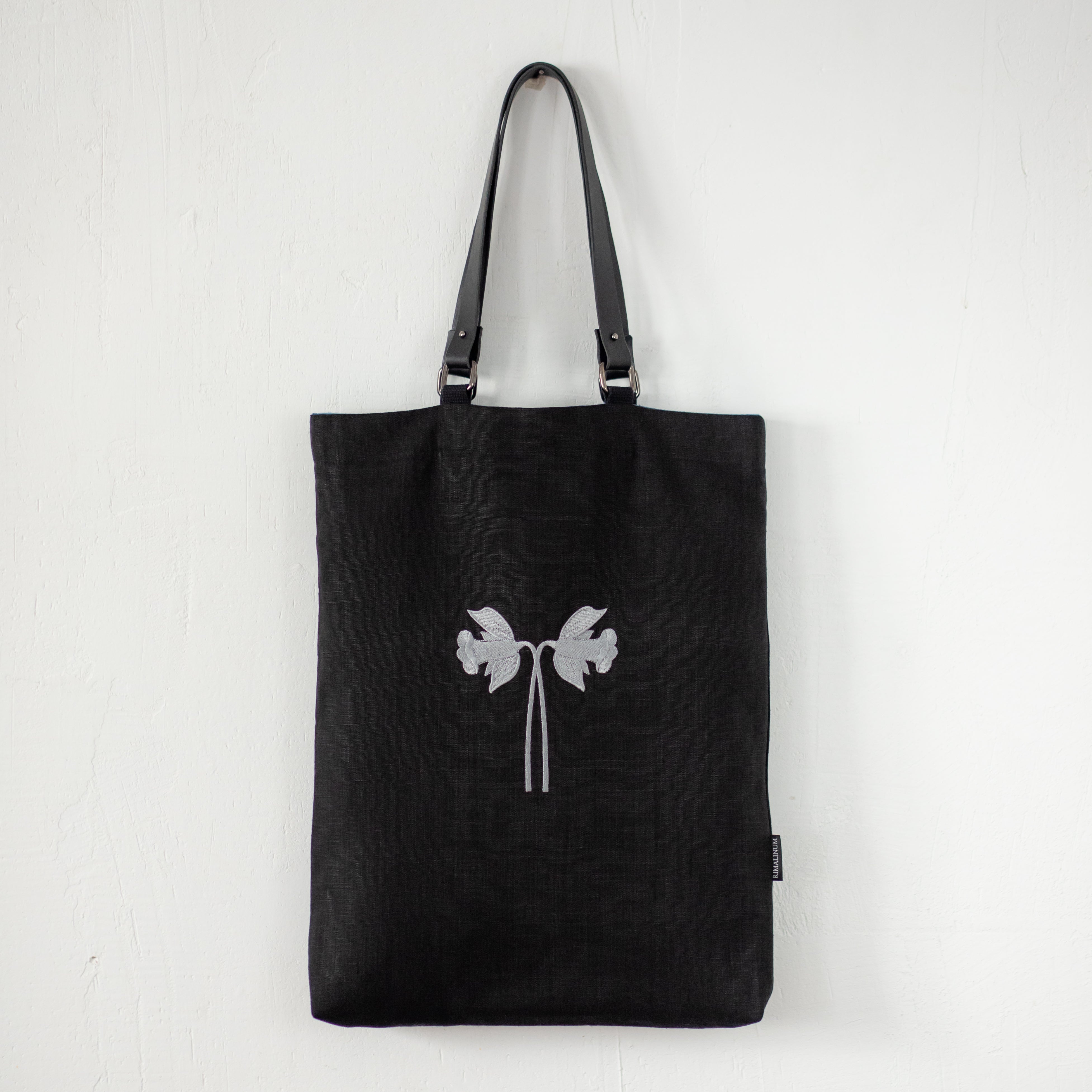 Oversized black canvas shoulder bag with embroidery and leather handles