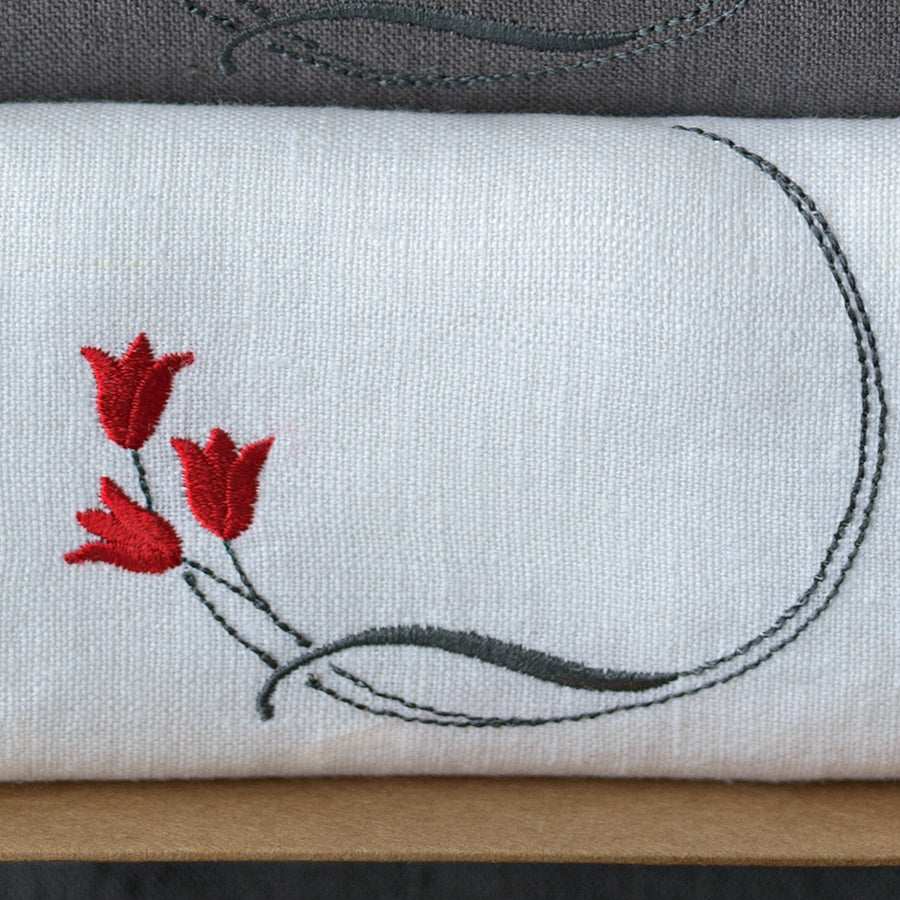 Tulip embroidery on a white linen napkin